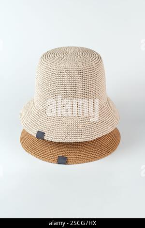 Beige and brown isolated hats on a white background. Hats mockup, no brand, front view presentation Stock Photo