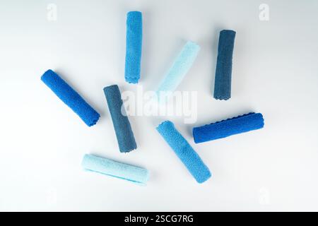 Colorful microfiber towels on a white table. Cleaning and housekeeping concept Stock Photo