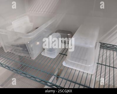 plastic containers on the shelf. Stock Photo