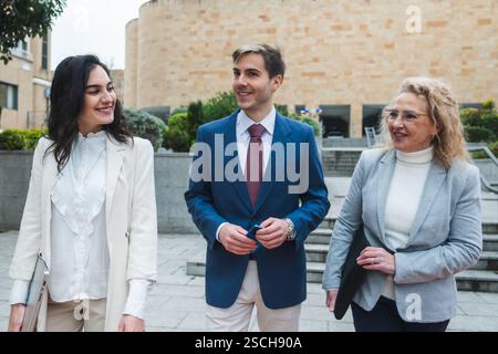 Businesspeople walking and talking in the city Stock Photo
