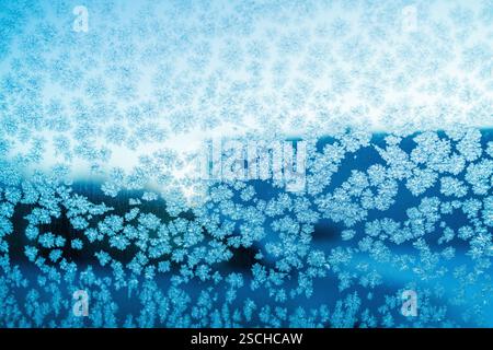 Close-up of intricate ice crystal formations on a window in Swedish Lapland, showcasing nature’s delicate artistry in this temporary ice hotel setting Stock Photo