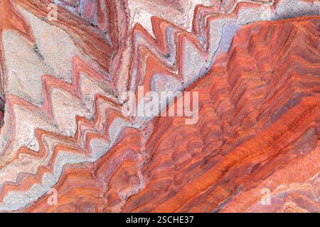 Winding Riger Aerial view of winding dry river channels carved across textured desert ...