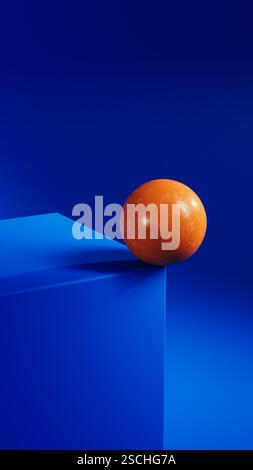 An orange sphere balances elegantly on a vibrant blue geometric shape, creating a striking contrast in this minimalist abstract composition. Stock Photo