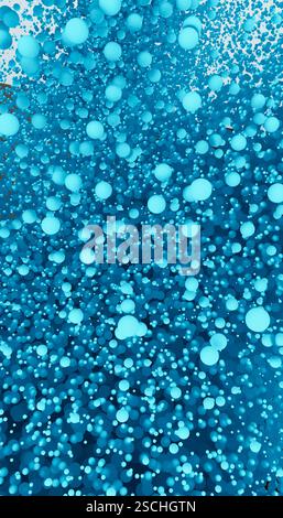 A visually striking 3D render showcasing a dense cluster of floating blue spheres with dynamic shading and light reflections, creating a cool toned ab Stock Photo