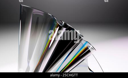 A close-up of a sleek glass sculpture showcasing a stunning reflective prism effect. The dynamic curves and rainbow hues create a modern, artistic des Stock Photo