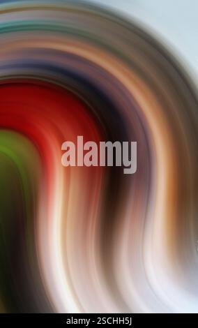 An evocative abstract photograph featuring a whirl of vibrant colors blending into a smooth gradient, eliciting a sense of movement and energy. Stock Photo