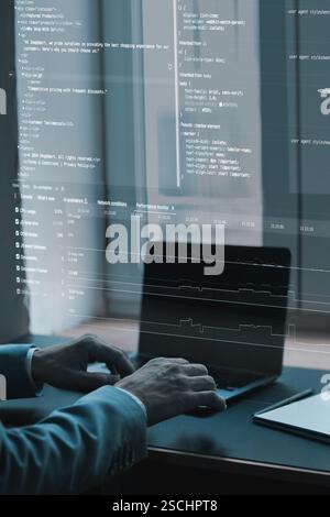 Close-up of coding interface projected over workspace. Fictional programming lines, website development elements Stock Photo