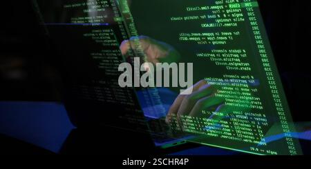 Dark setting with glowing green holographic screen displaying fictional coding interface. Hands interacting with digital elements Stock Photo