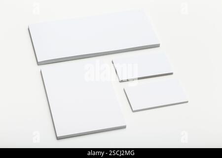 Various sizes of angle rulers arranged on a plain surface for drafting and measurement Stock Photo