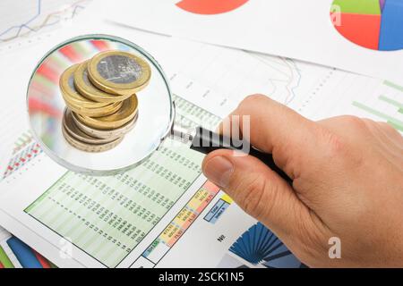 Graphs tables and documents laid on the table Stock Photo