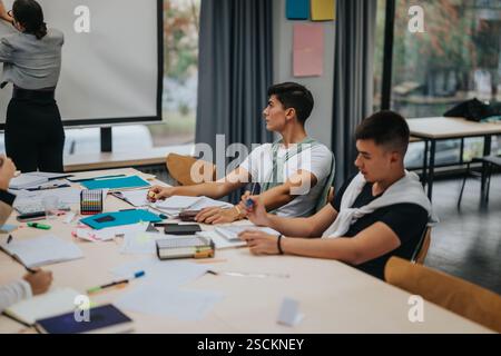 Students participating in a collaborative classroom setting Stock Photo