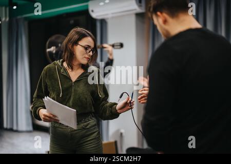 Musicians Engaging in Studio Rehearsal Preparing for an Upcoming Performance Stock Photo