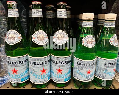 Kyiv, Ukraine - February 04, 2025: Display of San Pellegrino sparkling water bottles in a supermarket shelf arrangement Stock Photo