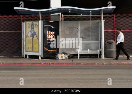 Homeless Bus Stop person sleeps at los angeles bus stop Stock Photo - Alamy