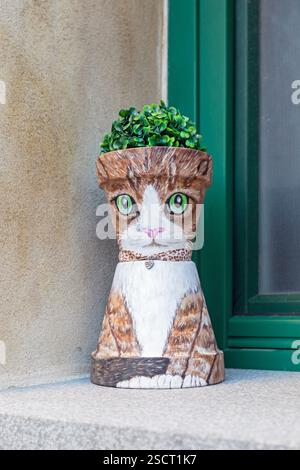 Flower pot in the shape of cat Stock Photo