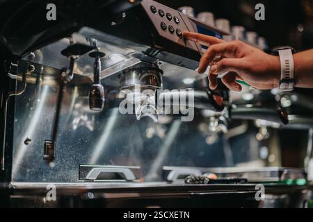 Barista Operating Professional Espresso Machine in Modern Cafe Stock Photo