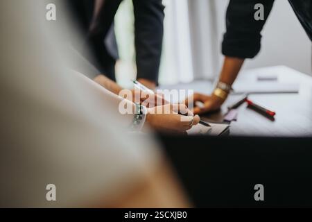 Students collaborating on school tasks in a teamwork setting Stock Photo