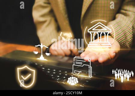 Depiction of digital governance and legal technology, featuring a woman with laptop and floating icons of law, security, and compliance, symbolizing e Stock Photo