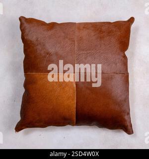Luxury decorative leather pillow isolated on grey marble background Stock Photo