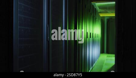 Rows of servers in data center glowing with green ambient light Stock Photo