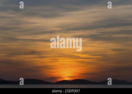 Atmospheric sunset over the sea with dramatically coloured sky, Sibenik, sibenik-Knin, Dalmatia, Croatia, Europe Stock Photo