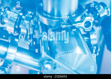 Stainless steel valves and safety lock mechanisms in modern food processing facility. Industrial grade sanitary equipment for quality control Stock Photo
