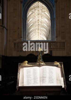Open Bible, with a page from the book of Proverbs, on a lectern in the quire of the christian cathedral at Canterbury, England. Stock Photo