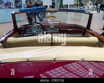 Classic convertible interior showcases vintage luxury at car exhibition Stock Photo