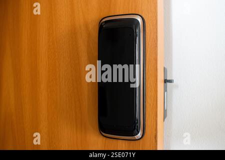 Electronic lock installed on the door. Stock Photo