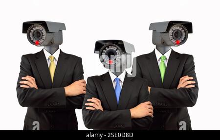 Safety team at the organization in concept of security management with surveillance cameras on the head of businessmen isolated over white background Stock Photo