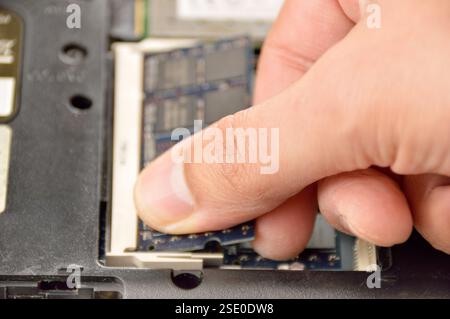 Replacement of memory in the laptop, in one of the service centers for repair of laptops. Stock Photo