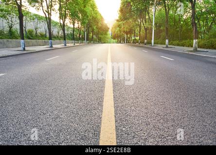 The straight road stretches into the distance Stock Photo