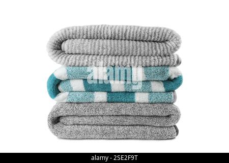 Soft fluffy striped grey and turquoise bath towels folded in stack isolated on white background. Terry cloth, striped pattern towel texture, cotton ba Stock Photo