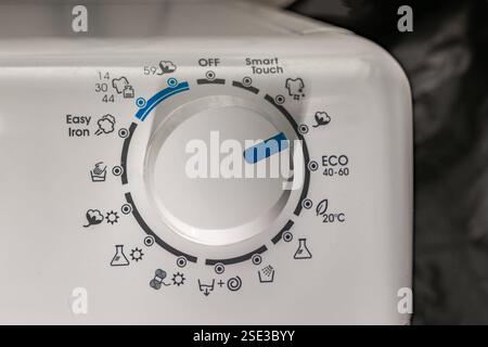 Washing in a washing machine, ecological program, saving energy and water washing machine in the bathroom Stock Photo