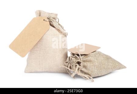 Burlap bags with tags isolated on white Stock Photo
