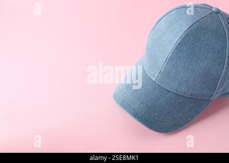 Stylish denim baseball cap on pink background. Mockup for design Stock Photo