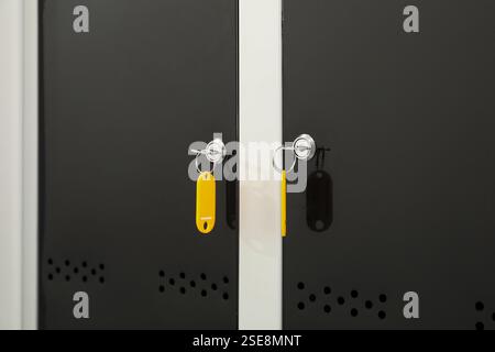 Modern lockers with bright keys, closeup view Stock Photo