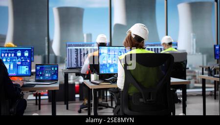Modern Black Engineer Using SCADA Software Controls Nuclear Power Plant Stock Photo