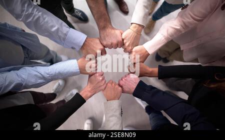 Business Team United in Effort to Stack Hands in Circle Stock Photo