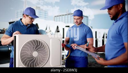 Skilled technician inspects air conditioner unit on commercial building rooftop. Stock Photo