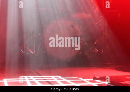 Munich, Germany, February 7th 2025: A white grid of light on the red floor and drum kit of focus on stage before the concert of focus at Tonhalle, Mun Stock Photo