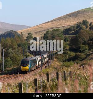 Avanti west coast Alstom pendolino train running through the scenic  Lune Gorge (south of Tebay, Cumbria) on the west coast mainline Stock Photo