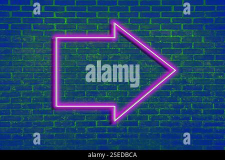 Pink neon arrow-shaped pointer on blue brick wall Stock Photo