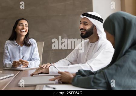 Group of professionals engaged in positive and collaborative meeting Stock Photo