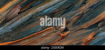 Vibrant Abstract Texture with Blue, Golden and Brown Streaks Blending in Shimmering Pattern Stock Photo