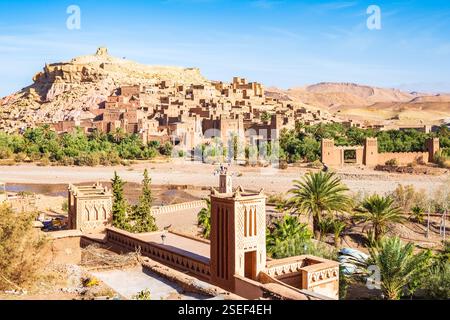 Ksar Ait Ben Haddou, old Berber adobe-brick village or kasbah in green oasis with palm trees, Ouarzazate, Morocco, North Africa Stock Photo