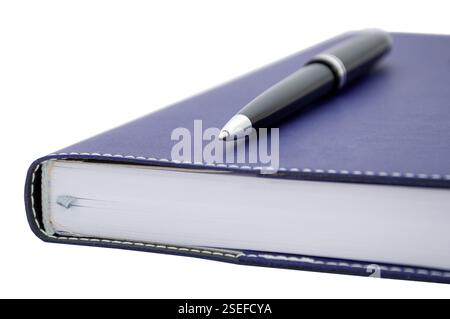 ballpoint pen is laying on paper notebook Stock Photo