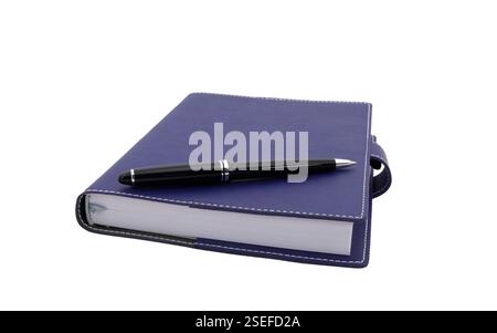ballpoint pen is laying on paper notebook Stock Photo