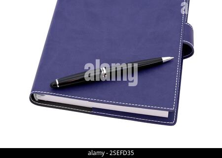 ballpoint pen is laying on paper notebook Stock Photo