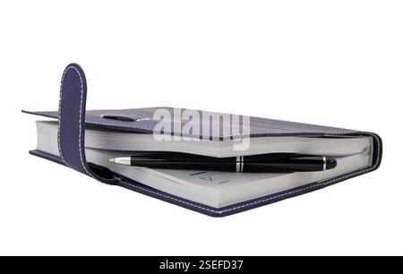 ballpoint pen is laying in paper notebook Stock Photo